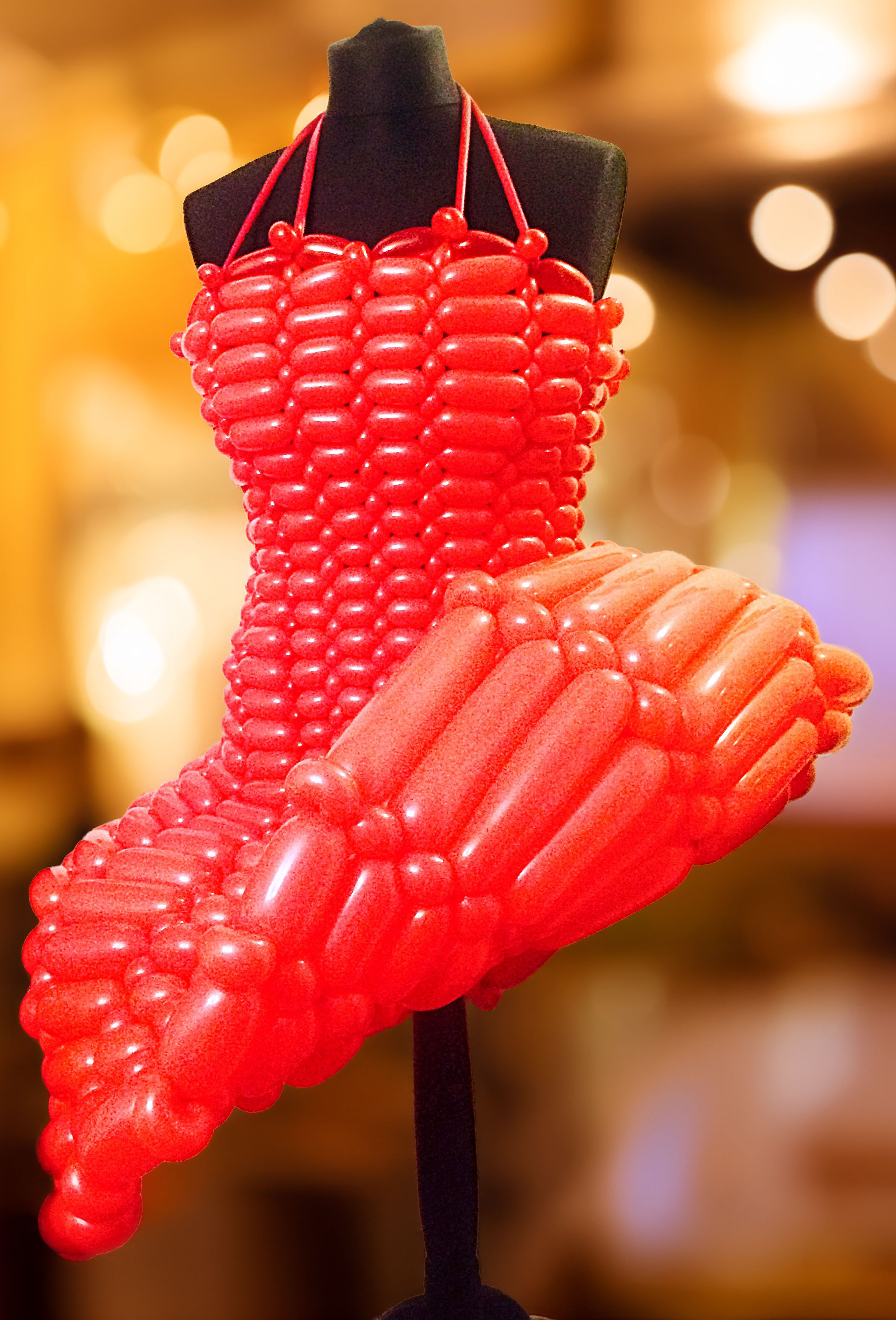 red balloon dress with curled up skirt on a mannequin